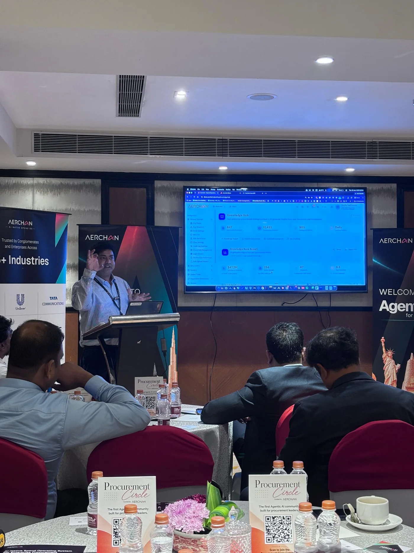 Speaker presenting an Aerchain procurement platform